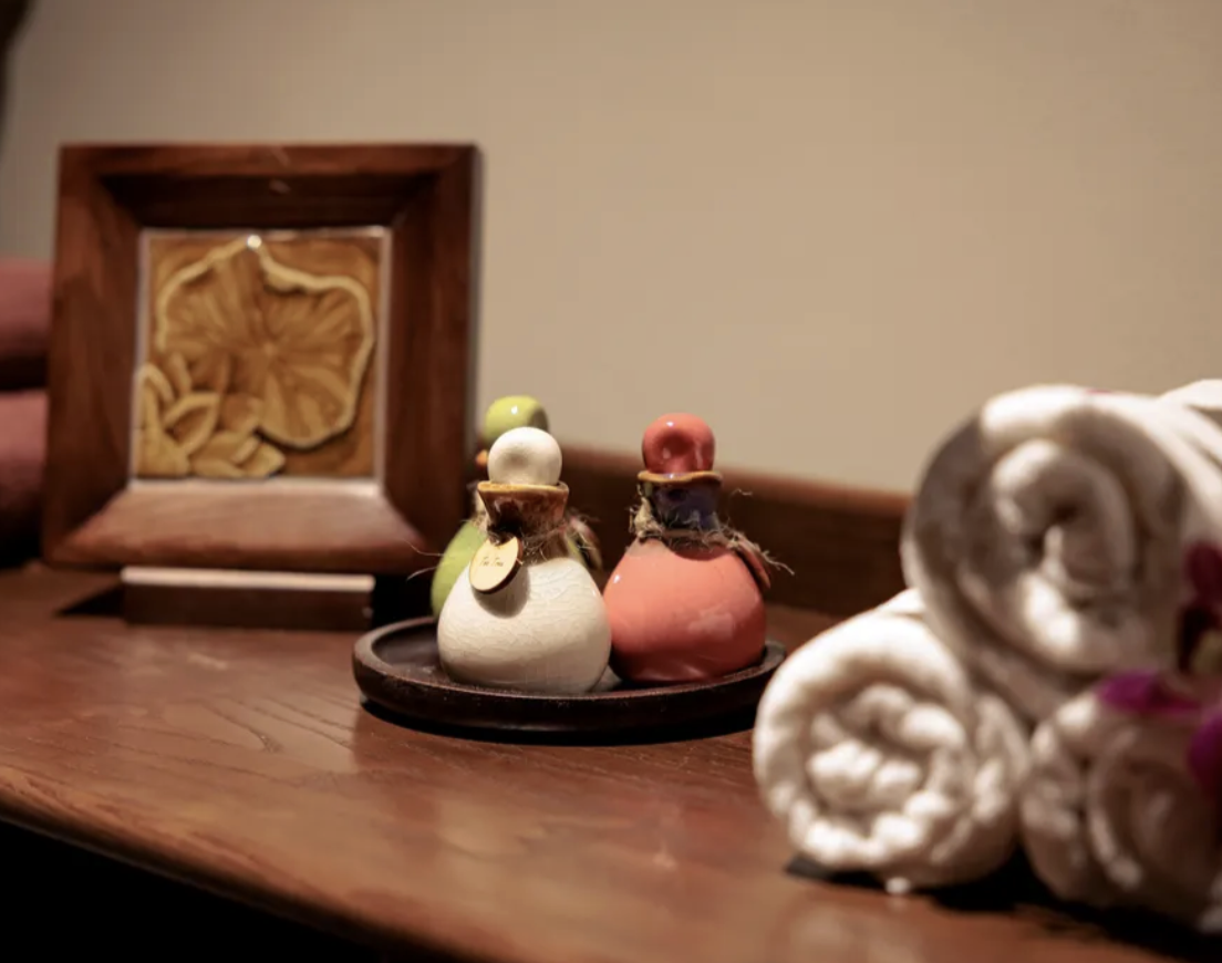 Paz Spa Bali detail shot with rolled towels and spa oils